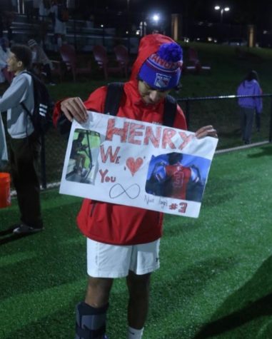 Center midfielder Henry Sellinger holds a card from his teammates.