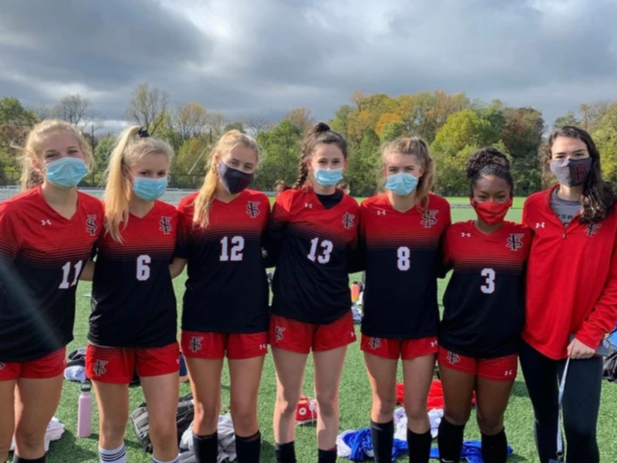 Senior Girls Varsity Soccer players post-win in October 2020 
