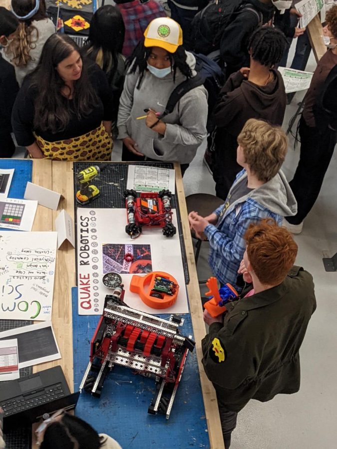 Robotics Club members Sophie von Coelln and Ryan Ellis make their pitch at the Spring 2022 STEAM fair.