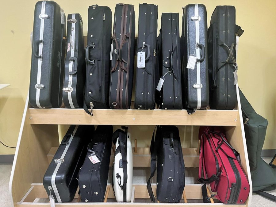 A rack of orchestra instruments sits in the Friends Upper School music room.