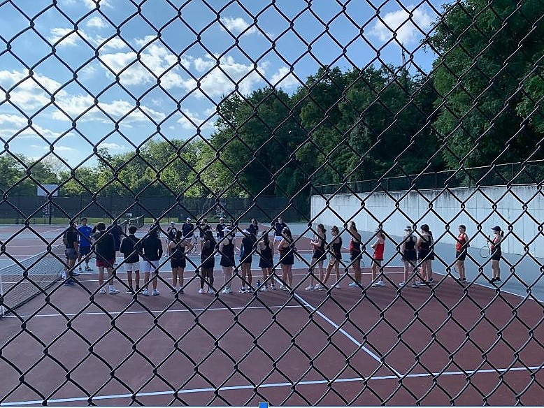 The girls tennis team lines up before their match.