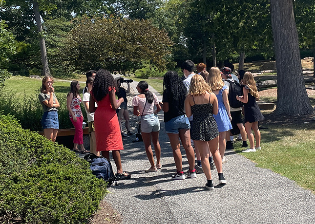 Seniors line up in the heat to have their final yearbook photos taken.