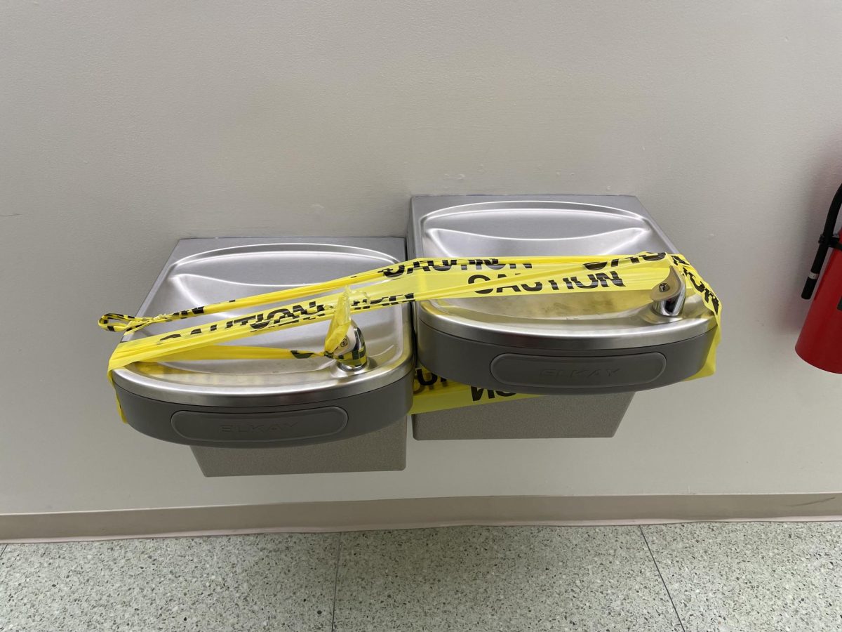 Water fountains in Forbush Hall are wrapped with Caution tape after low levels of a parasite found in the water supply caused a boil-water advisory in Baltimore earlier this month.
