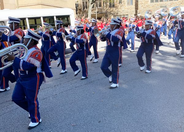 The Morgan State University Marching Band processes down the Friends School driveway, lined with cheering crowds of students, from preschoolers to 12th graders.