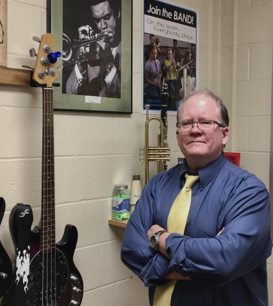 Band director Wade Zagurski with some of the many instruments he has mastered.