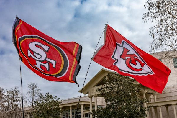 Flags fly as the San Francisco 49ers and the Kansas City Chiefs prepare to face off in SuperBowl 58.