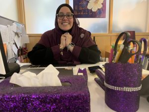 Rasha El-Haggan, Friends Schools new Assistant Head of School for Academics, sits in her office, surrounded by sparkles.