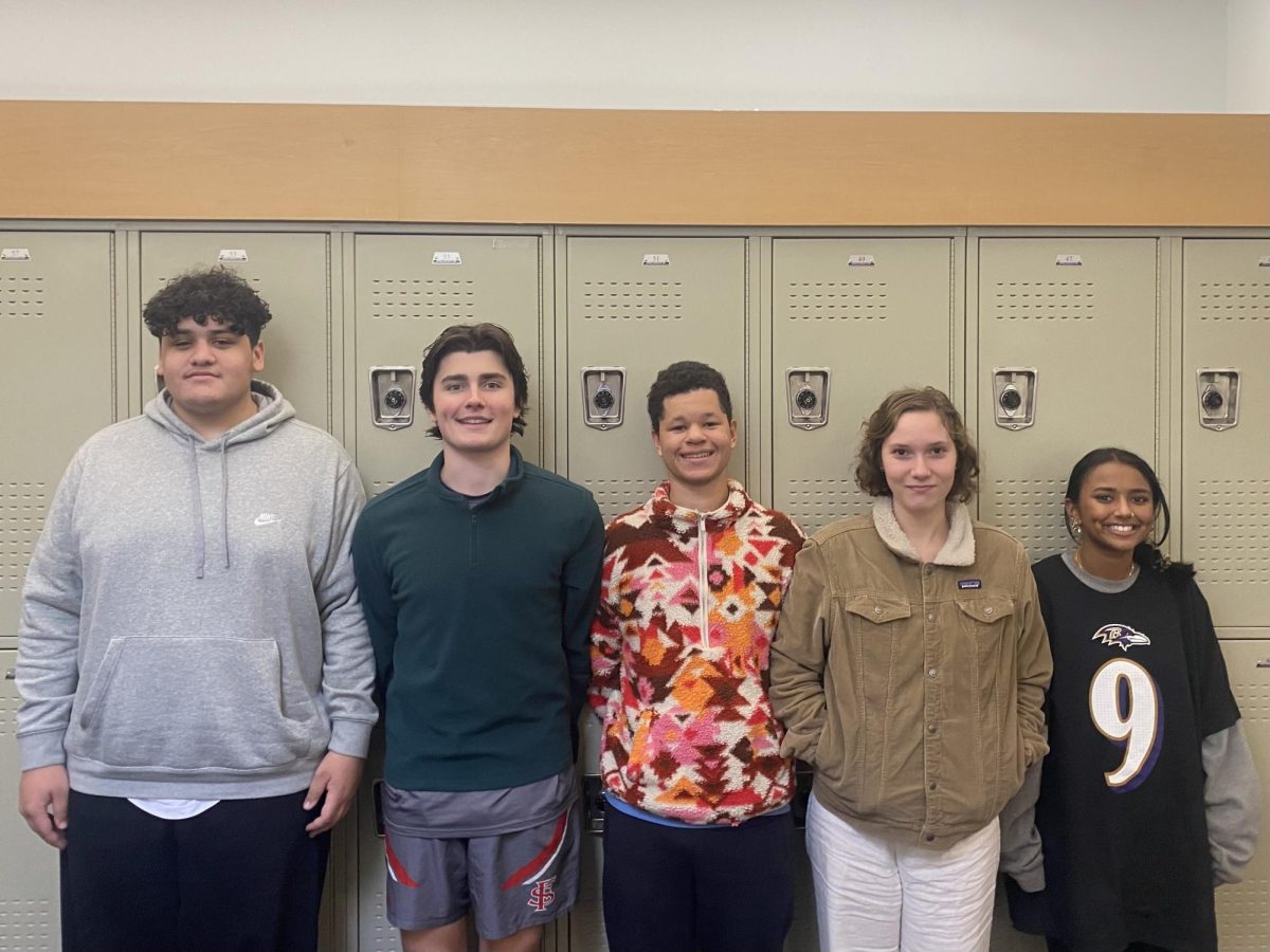 Five of the nine first-time voters featured in this podcast stand in Senior Hall.