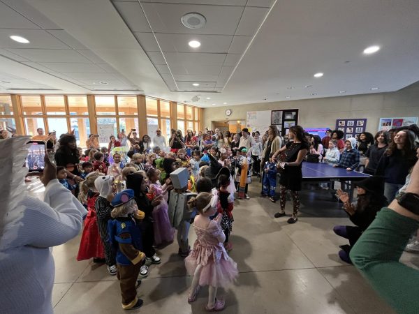 Four- through 14-year-old Friends students gathered in the Middle School lobby for some shared Halloween fun.