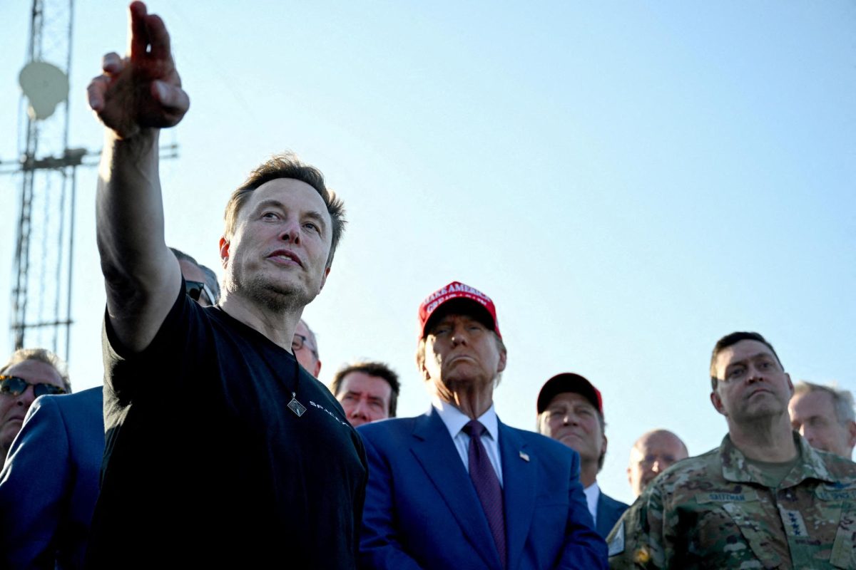 Elon Musk speaks with U.S. President-elect Donald Trump and guests at a viewing of the launch of the sixth test flight of the SpaceX Starship, in Brownsville, Texas, U.S., November 19, 2024 . Brandon Bell/Pool via REUTERS