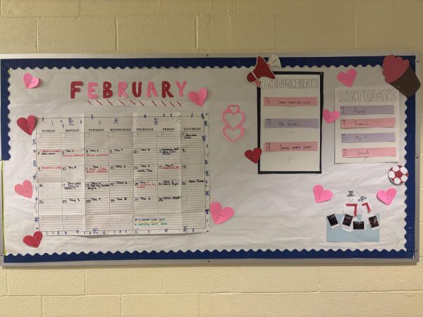 A bulletin board in the Science/Math building celebrates Valentine's Day and February birthdays.