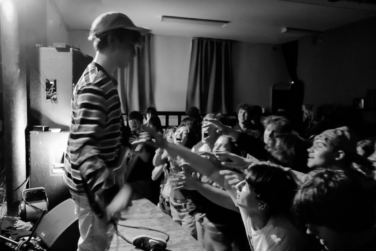 The crowd reaches for Neil Cooper during a show at the Undercroft on February 8th, 2025.