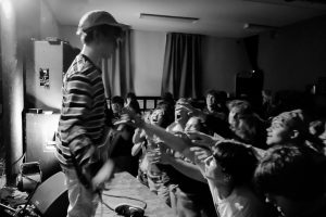 The crowd reaches for Neil Cooper during a show at the Undercroft on February 8th, 2025.