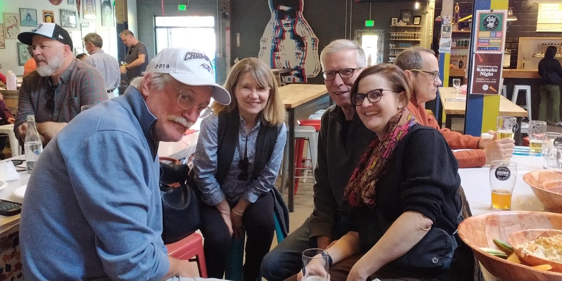 Colleagues Tom Buck, Koniezhny, and Jennifer Robinson (along with Robinson's partner Larry) celebrate Spanish teacher Dahira Binford's birthday at Union Craft Brewing.