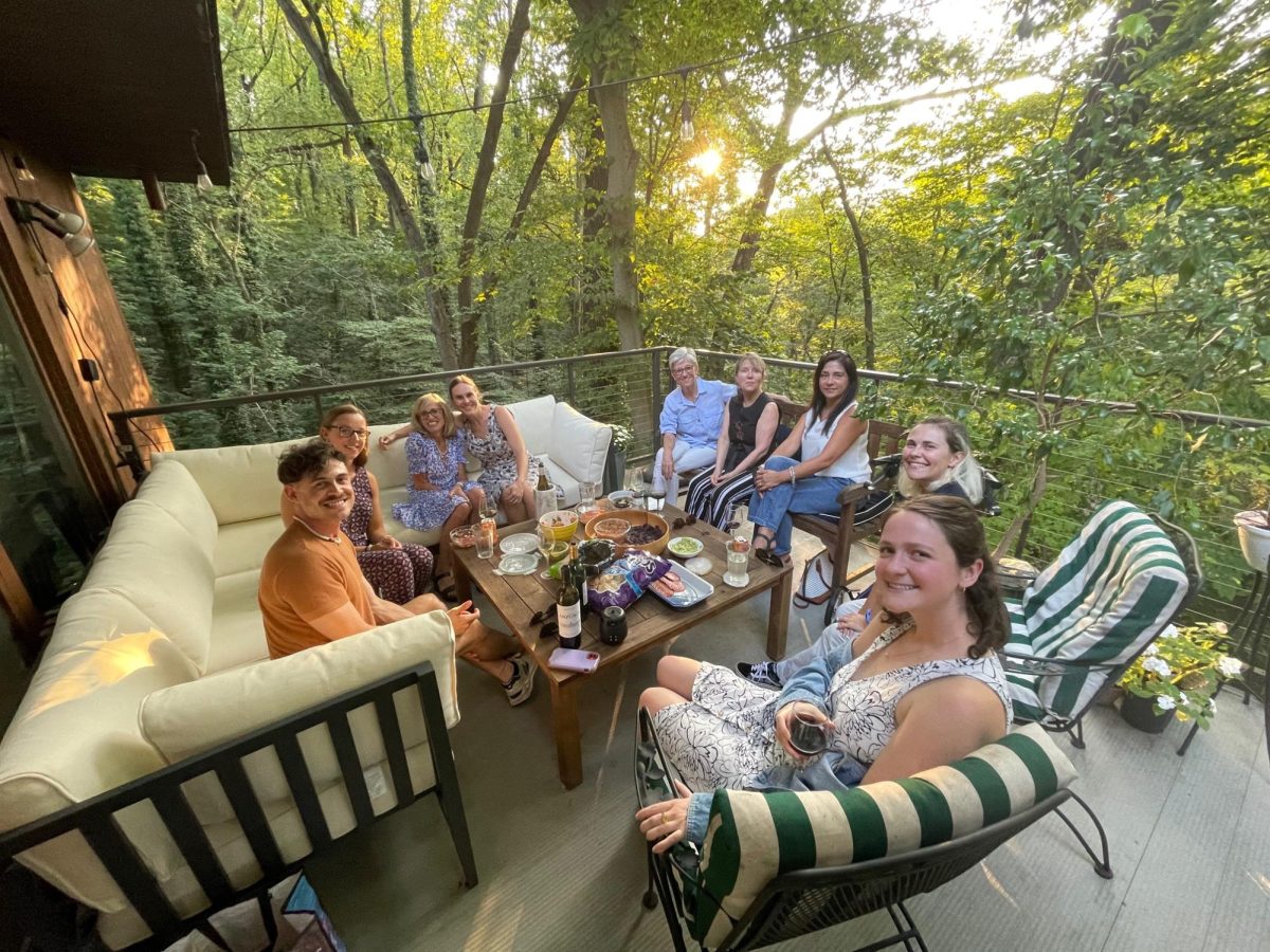 Language department colleagues gather in fall 2024 on Lucy Hand's deck: Cesar Castellon Gort, Marta Reinaldo, Lucy Hand, Kristen Andrews, Cristina Tejada, Christine Koniezhny, Maricelly Kraska, Stella Bowman, and Isabel Cooke.