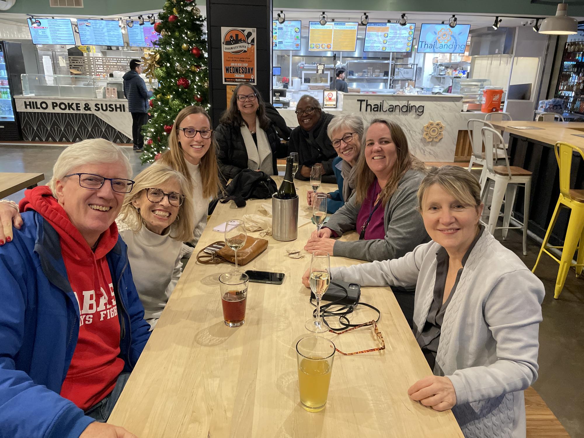 Language department colleagues share a drink at Belvedere Square in December 2024.