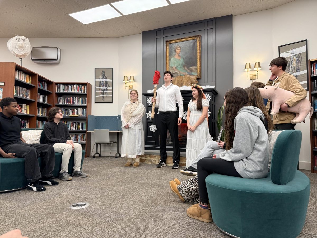 Members of the Latin II class perform a traditional Roman wedding ceremony for a standing-room-only crowd in the Upper School Library. 