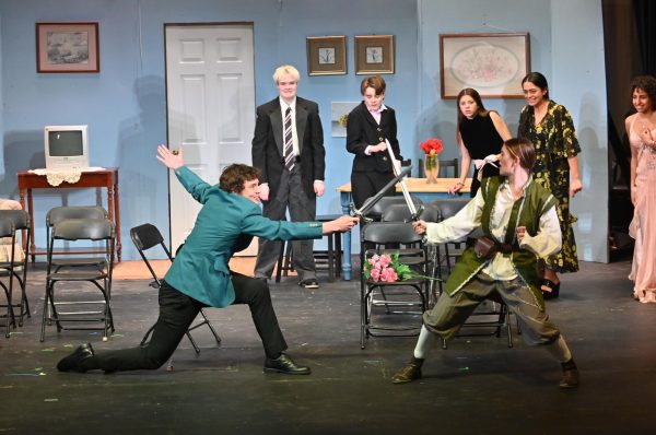 Brack Wilner '26 and Lara Hams '26 swordfight as fellow cast-members look on during a production of The Matchmakers directed by Nico Garza '26 and Nikki Eggert '27.